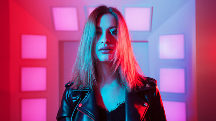 Futuristic style portrait in blue and purple light.