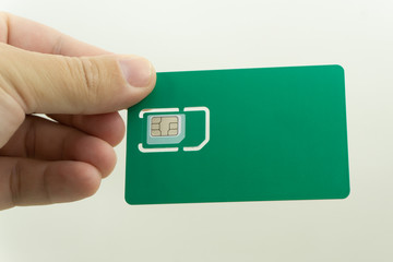 used mobile phone sim card macro isolated on white