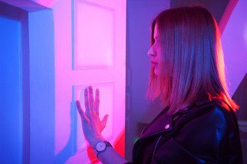 Futuristic style portrait in blue and purple light.