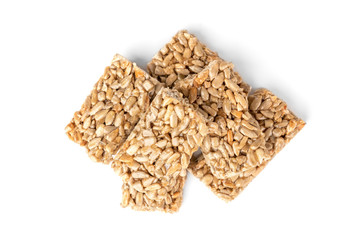Sunflower seed kozinaki isolated on white background. Sweet bars with seeds and caramel. 
