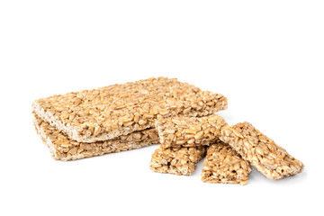 Sunflower seed kozinaki isolated on white background. Sweet bars with seeds and caramel. 