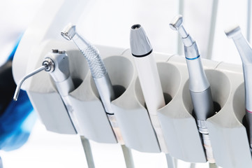 Close-up set of professional tools in the dentist's office on the holder. High key. Stamotology concept
