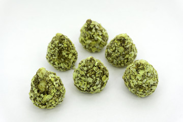 Walnut in chocolate candy close up powdered