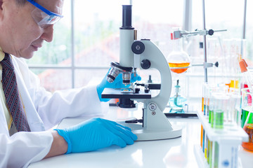 The scientist test new product by test tube in health sciences, life sciences and chemistry experiments.
