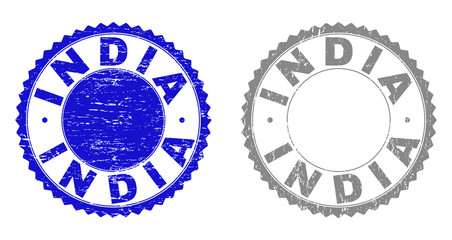 Grunge INDIA stamp seals isolated on a white background. Rosette seals with grunge texture in blue and gray colors. Vector rubber stamp imitation of INDIA caption inside round rosette.