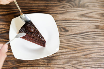 Chocolate cake put on the white dish,Relax time with Chocolate fudge cake,selective focus