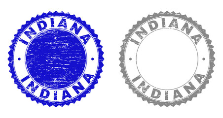 Grunge INDIANA stamp seals isolated on a white background. Rosette seals with grunge texture in blue and grey colors. Vector rubber stamp imitation of INDIANA title inside round rosette.