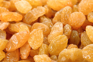 Tasty raisins as background, closeup. Healthy dried fruit