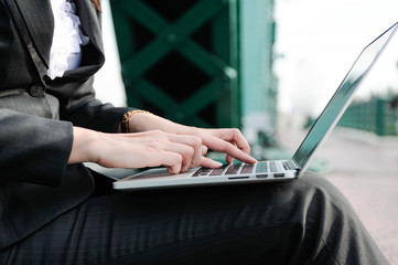 Business women using notbook,women using hand press computer keyboard,selective focus,Social network