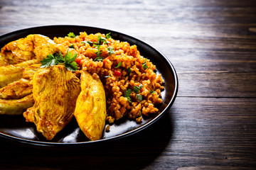 Roasted meat, groats and vegetables