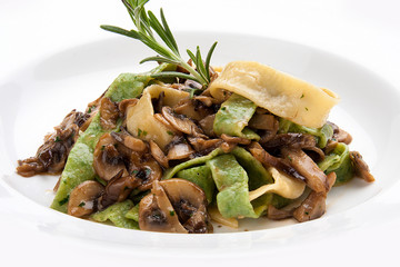Pasta tagliatelle with mushrooms on a white background