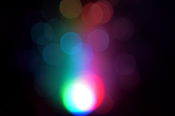multicolored highlights on a dark background, colored lights blurred out