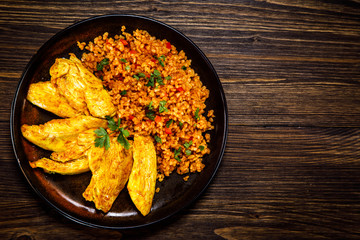 Roasted meat, groats and vegetables