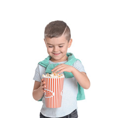 Cute little boy with popcorn on white background