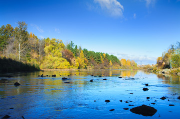 The autumn river of Miass is below the Shershnevskaya dam.