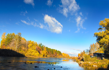 The autumn river of Miass is below the Shershnevskaya dam.