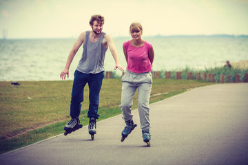 Teens together on skating date.