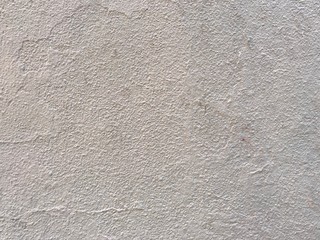 White stipple effect wall in grey color texture background