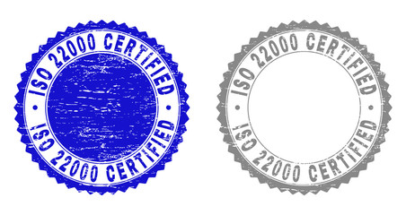 Grunge ISO 22000 CERTIFIED stamp seals isolated on a white background. Rosette seals with grunge texture in blue and gray colors.