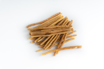 Natural toothbrush Miswak (Kayu Sugi) on white background with selective focus. It is a teeth cleaning twig made from the Salvadora persica tree and also know as miswaak, siwak, Sugi or sewak
