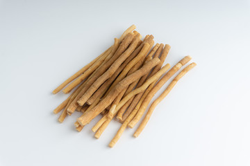 Natural toothbrush Miswak (Kayu Sugi) on white background with selective focus. It is a teeth cleaning twig made from the Salvadora persica tree and also know as miswaak, siwak, Sugi or sewak