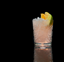 Refreshing alcoholic cocktail with crushed ice and citrus fruits on black background