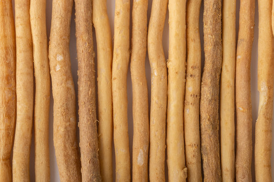 Natural toothbrush Miswak (Kayu Sugi) on white background with selective focus. It is a teeth cleaning twig made from the Salvadora persica tree and also know as miswaak, siwak, Sugi or sewak