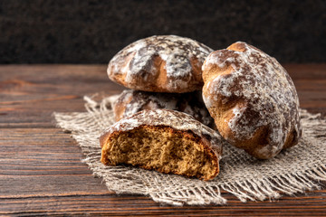 Traditional russian gingerbread on dark wooden background.