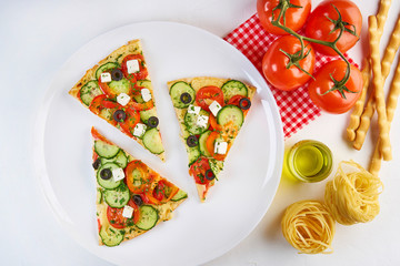 Sliced pizza with ingredients on white background. Top view, flat lay