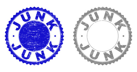 Grunge JUNK stamp seals isolated on a white background. Rosette seals with grunge texture in blue and gray colors. Vector rubber stamp imprint of JUNK title inside round rosette.