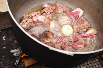 Lamb pieces with whole onion stew