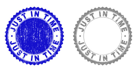 Grunge JUST IN TIME stamp seals isolated on a white background. Rosette seals with grunge texture in blue and grey colors. Vector rubber stamp imitation of JUST IN TIME caption inside round rosette.