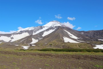 Fototapeta premium View of Avachinsky volcano. Avachinsky (also known as Avacha or Avacha Volcano or Avachinskaya Sopka) is an active stratovolcano on the Kamchatka Peninsula in the far east of Russia.