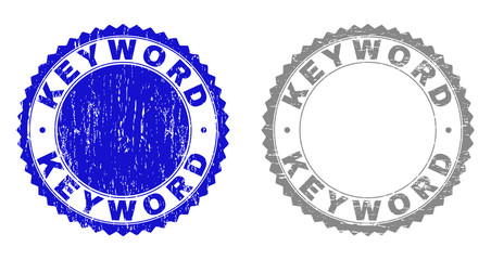 Grunge KEYWORD stamp seals isolated on a white background. Rosette seals with distress texture in blue and grey colors. Vector rubber stamp imprint of KEYWORD text inside round rosette.