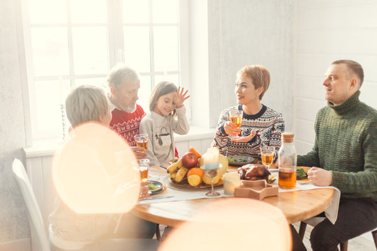 awesome pleasant people are having fun indoors, friendly extended family spending time together - Powered by Adobe