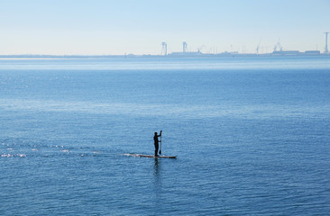 silhouette of SUP near andalusia coastline in february