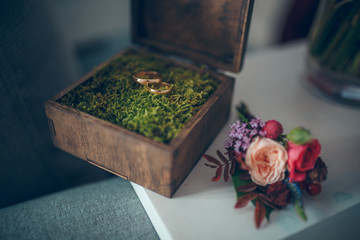 wooden wedding ring box and wedding bouqet