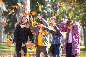 Friends in the park with leaves