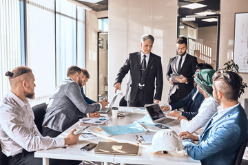 boss and his co-workers elaborating a new law elaboration, development concepts