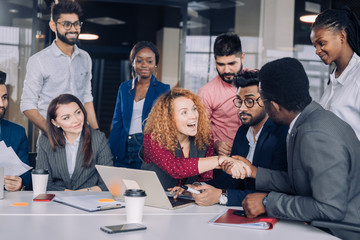 Business Corporate Management Planning Team Concept. Teamwork process.Young multiracial entrepreneurs work with new startup project in office. Nine diverse people sharing the ideas lively.