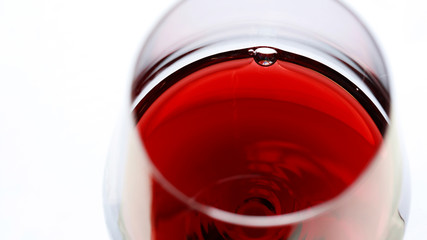 Defocused glass with red wine