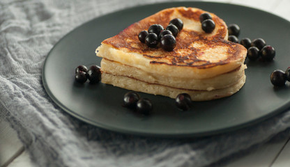 Heart-shaped pancakes with currant jam