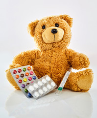 Toy bear with medicine