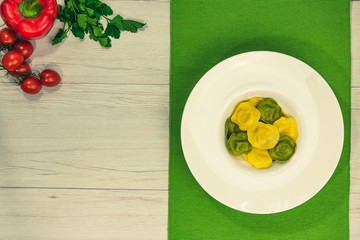 Cassic ravioli filled with basilico and cheese in a plate.