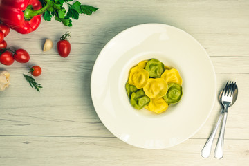 Cassic ravioli filled with basilico and cheese in a plate.