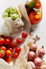 Top view of organic groceries in net bags