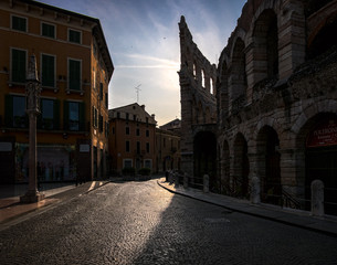 Walking through the old town of Verona at dawn. Roman Coliseum. Arena Verona.