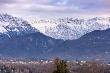 Winter panorama between Cassacco and Tricesimo. From the hills to the snow-capped mountains. Sunrise