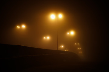 bridge in the fog with the lights