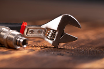 closeup of adjustable wrench and coupling. fitting 1/2.Nice blurring background.